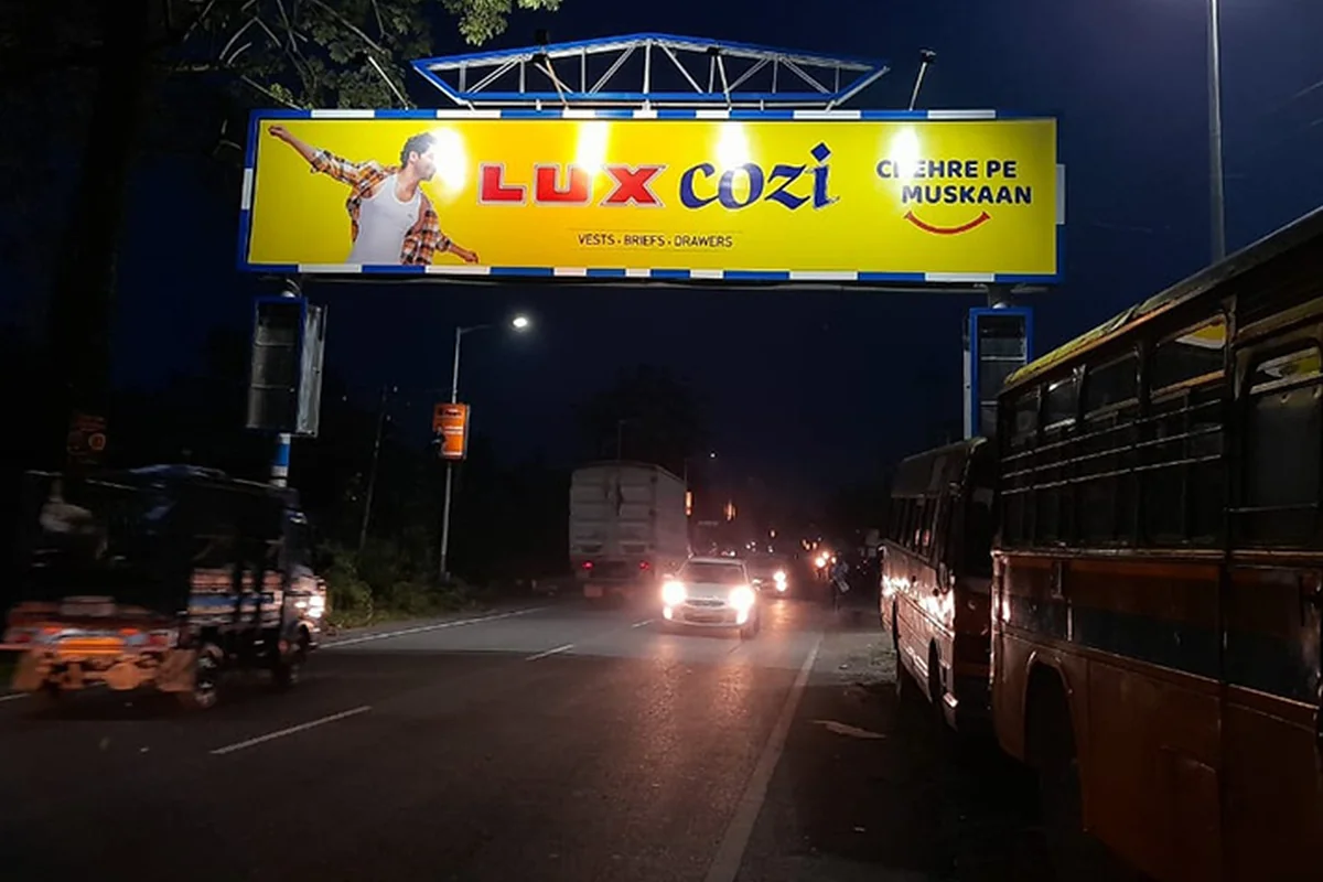 Malbazar - Board 02 - Near Enfield Showroom - BSF Camp - View 1 (50'X10', FRONT-LIT, Both Side)