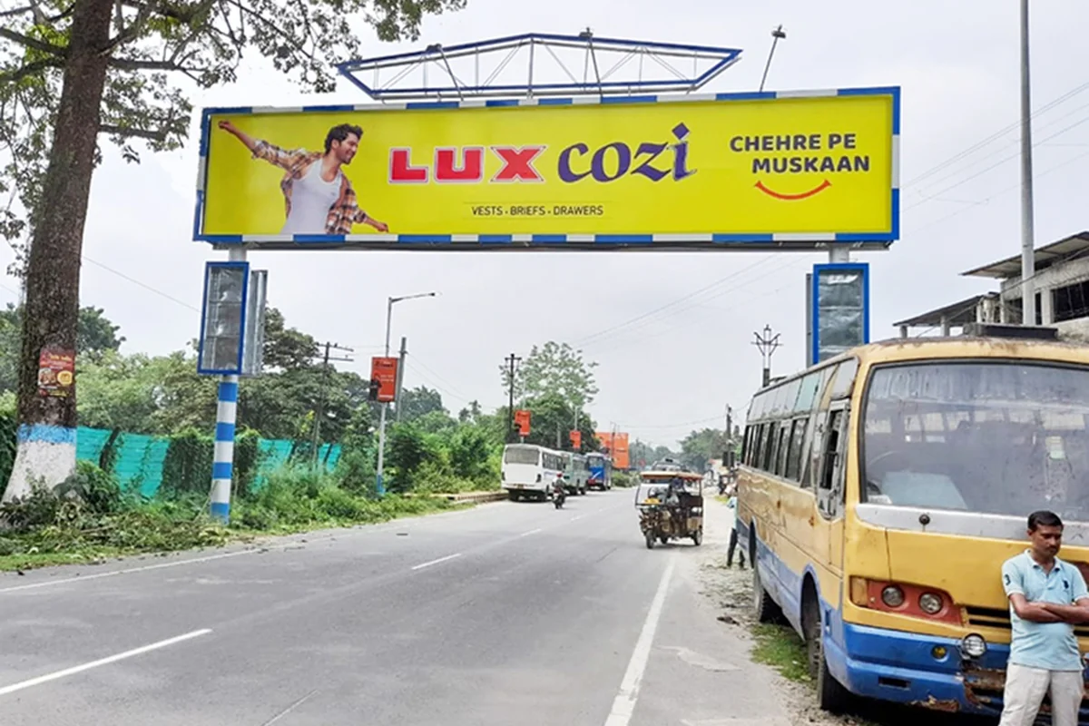 Malbazar - Board 02 - Near Enfield Showroom - BSF Camp - View 2 (50'X10', FRONT-LIT, Both Side)